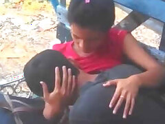 Indian lover in public park sucking boobs
