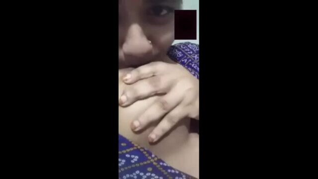 Bengali girl sucking her own boobs
