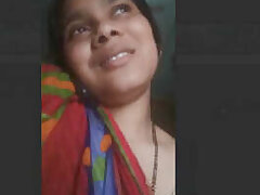Bhabhi masturbating and talking on phone