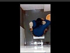 indian girl changing pad in toilet